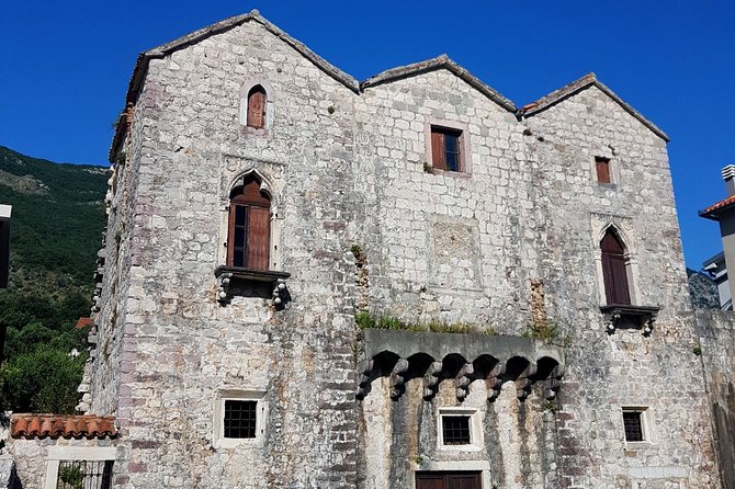 Bike tour - Kotor Bay circle and visit Our Lady of the Rock - Perast, coffee, and the island visit